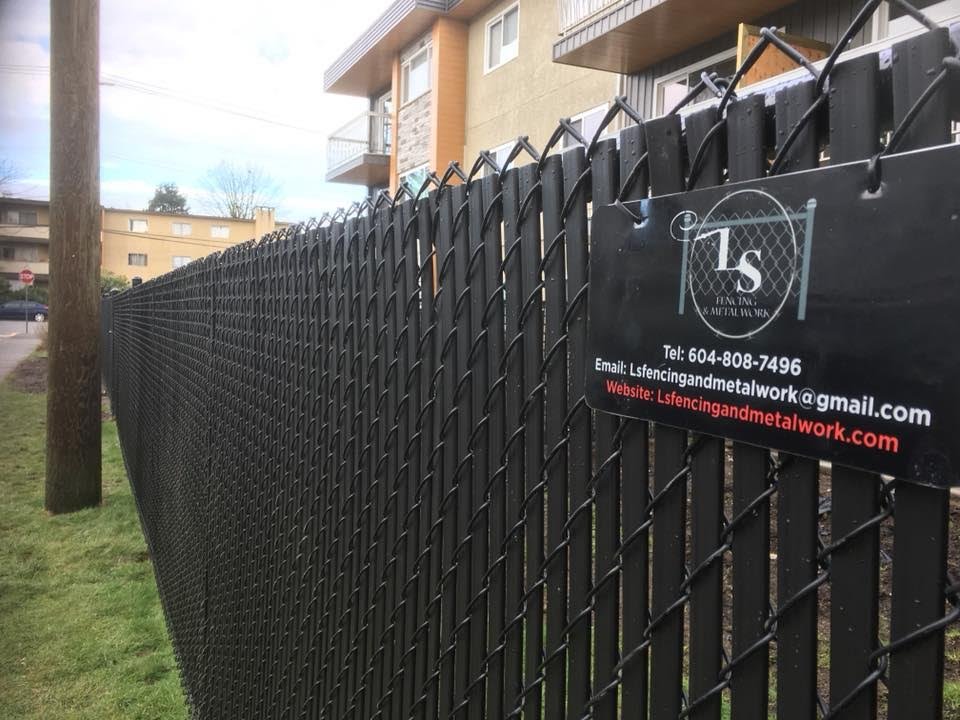 Residential yard enclosed with chain link panels fraser valley