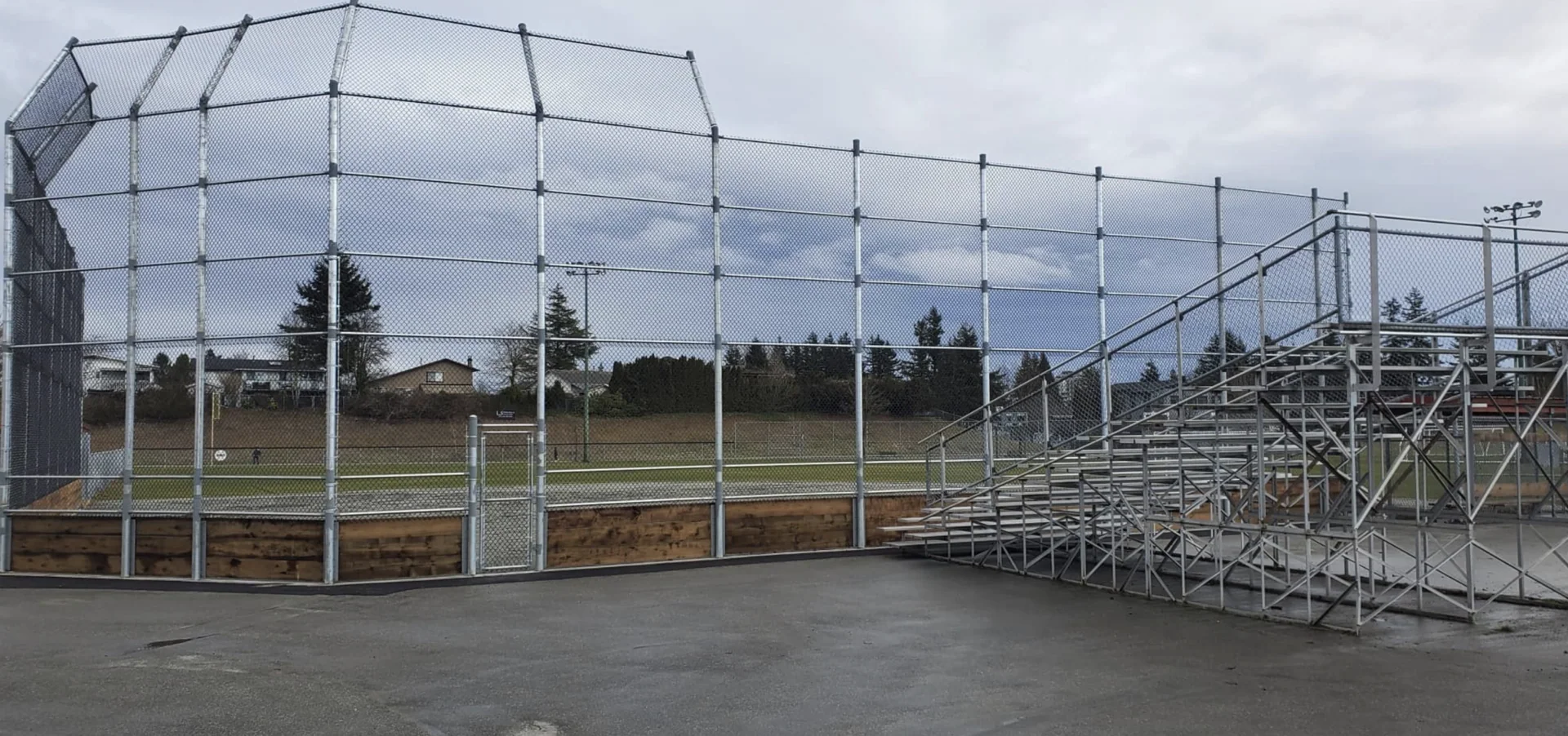 Industrial chain link fencing with reinforced posts for sports fields