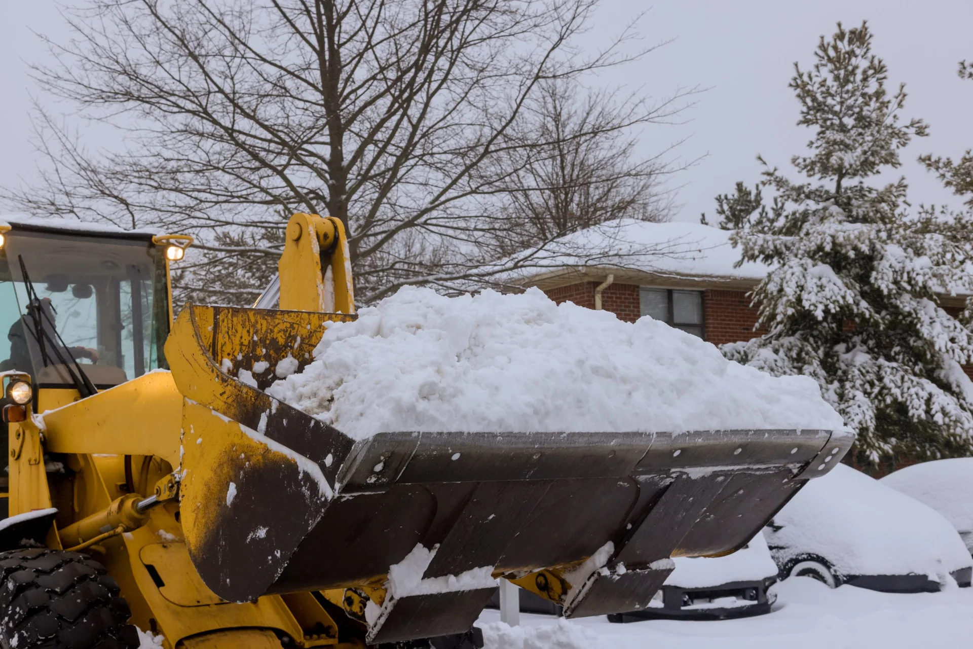 front end loader clears snow removal after snowfall blizzards clearing Chilliwack